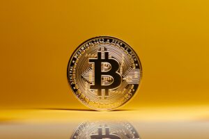 bitcoin on yellow studio background