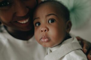 toddler and a woman in close up photography
